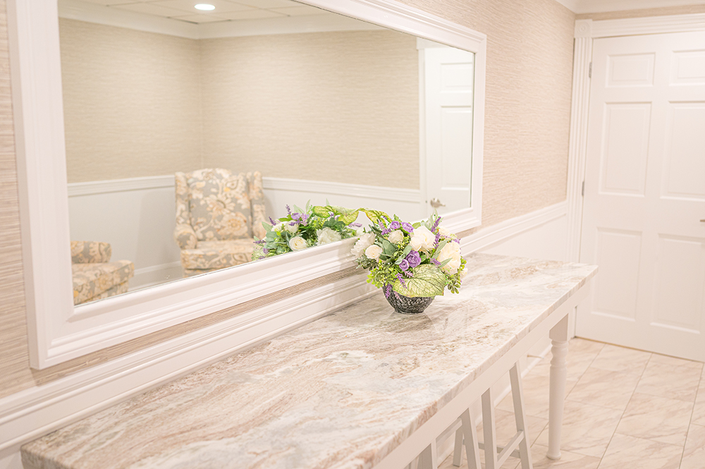 Closeup of a marble counter in front of a mirror in a bridal suite at the Aqua Turf.