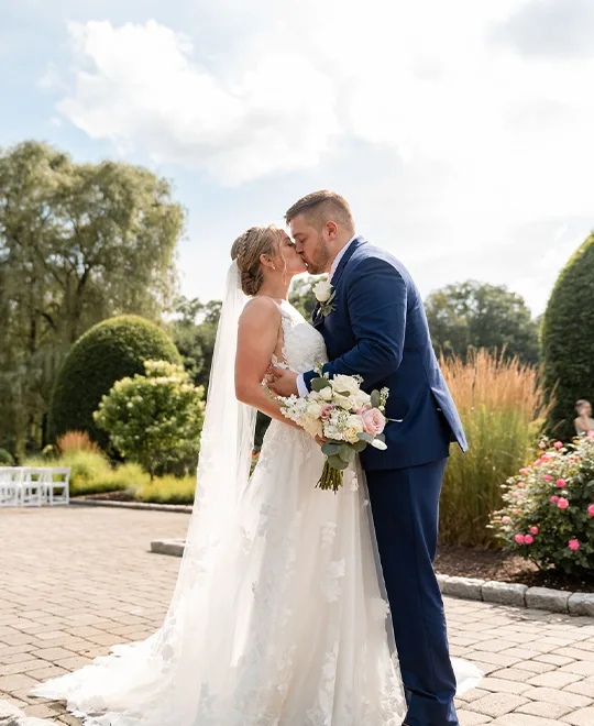 Bride and groom kiss 