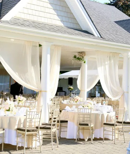 Tables set up outdoors for wedding reception