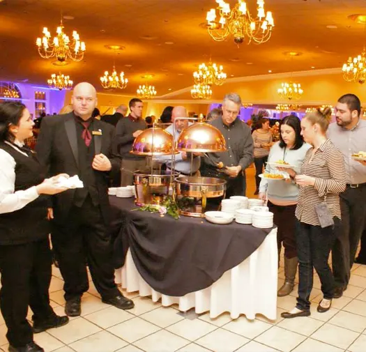 Guests serve themselves at a luncheon buffet