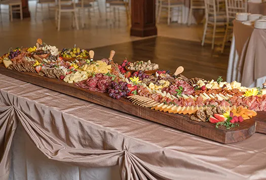 A large deli meat and cheese platter prepared for an anniversary party